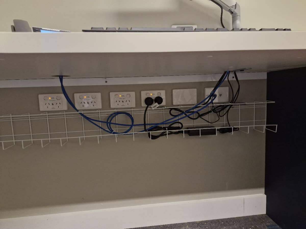 Under desk cable management in a commercial office